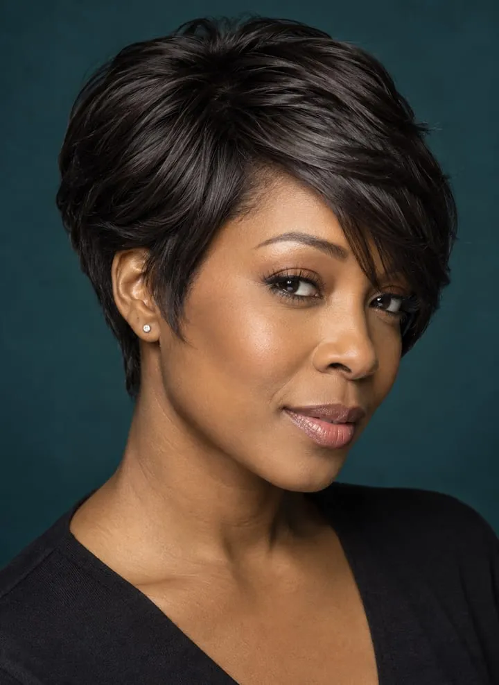 Woman with fine dark hair wearing a compact side-swept bixie