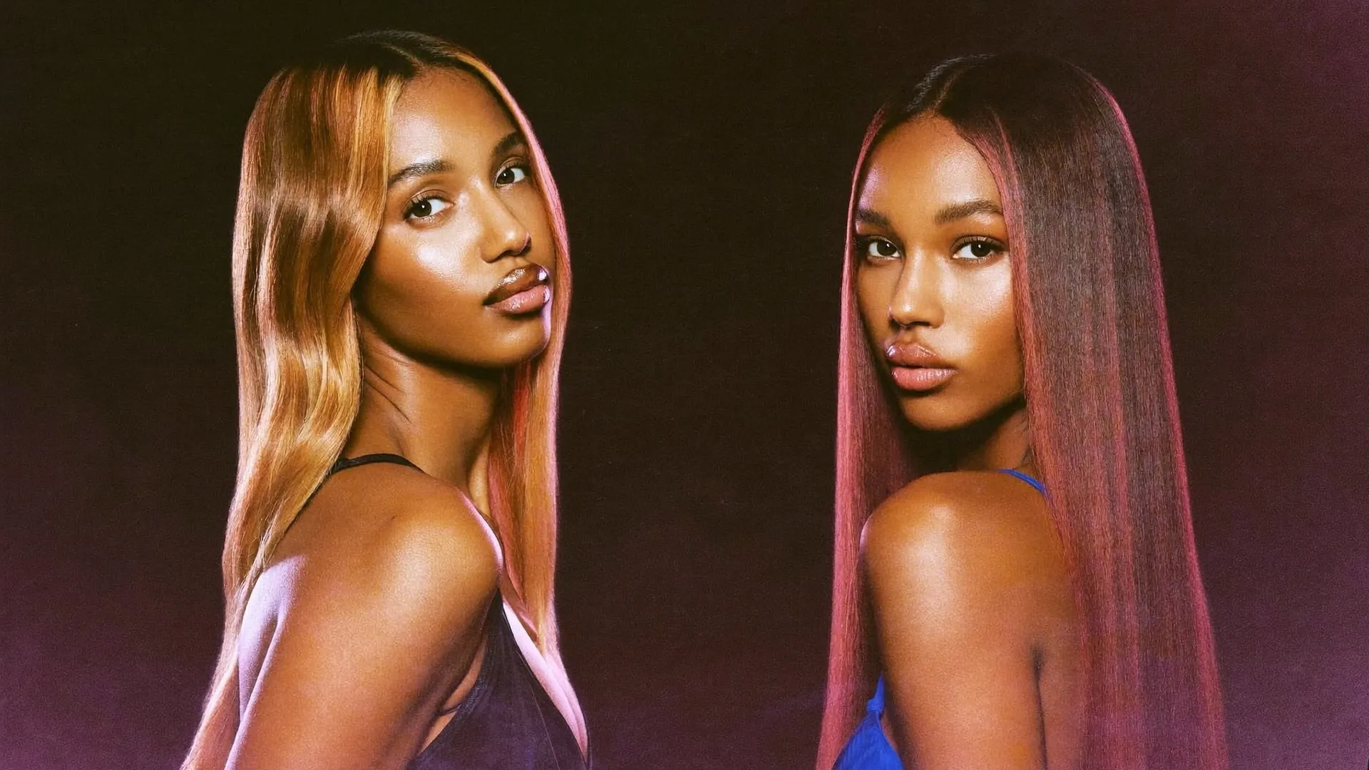 Two women with different undertones, one with warm caramel-copper hair and one with deep burgundy-brown hair